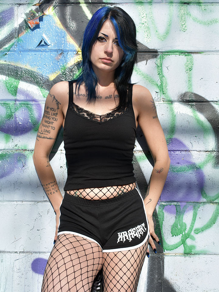 
                  
                    Black goth Vampire Booty Shorts with white trim. Tattoo inspired Dark Art by Xraeart Clothing alternative streetwear.
                  
                